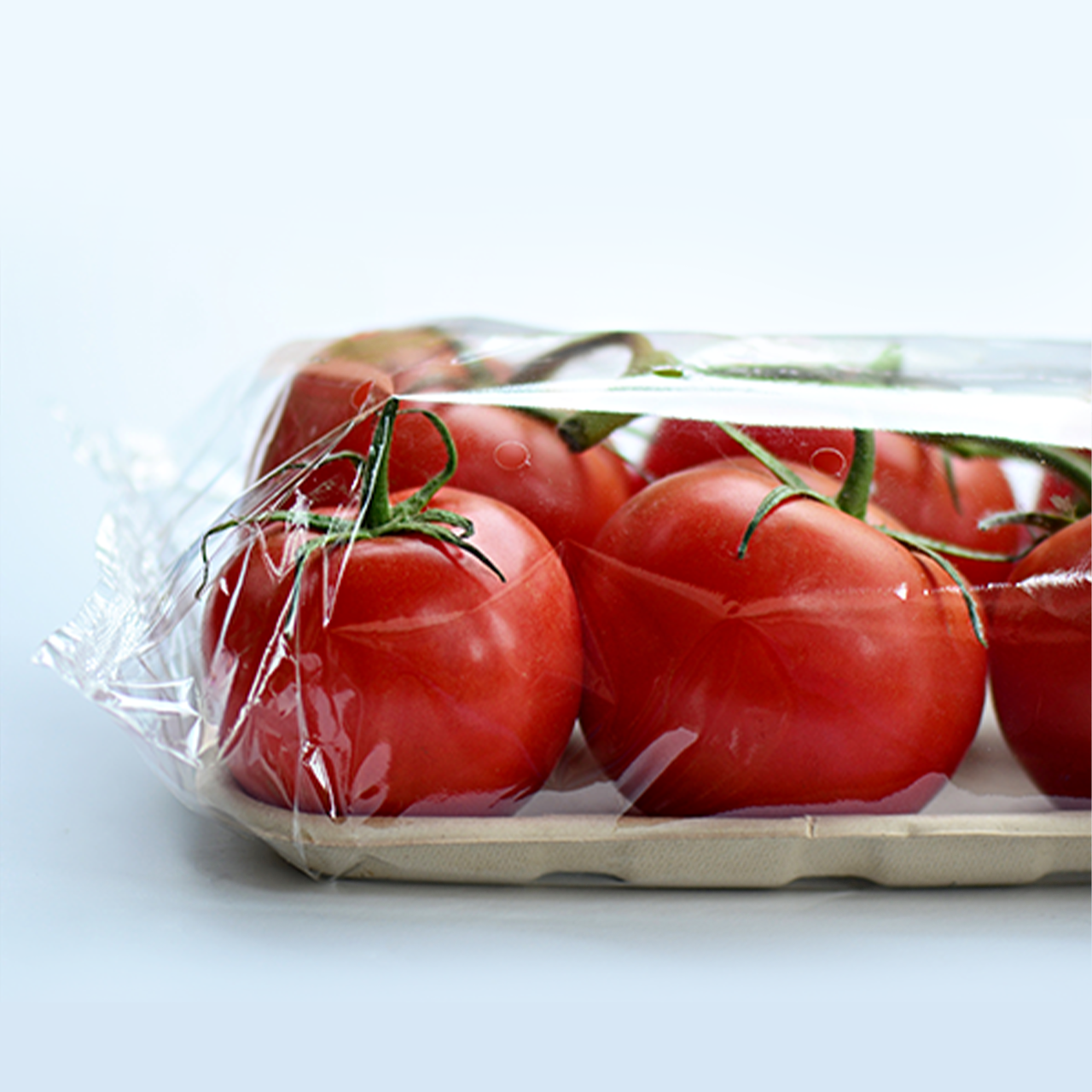 Tomatoes wrapped in plastic to preserve freshness
