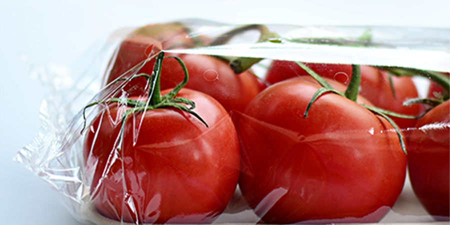 Tomatoes wrapped in plastic to preserve freshness
