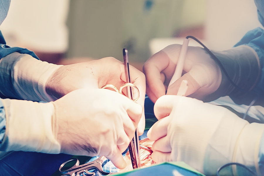 Medical professionals performing a heart procedure.
